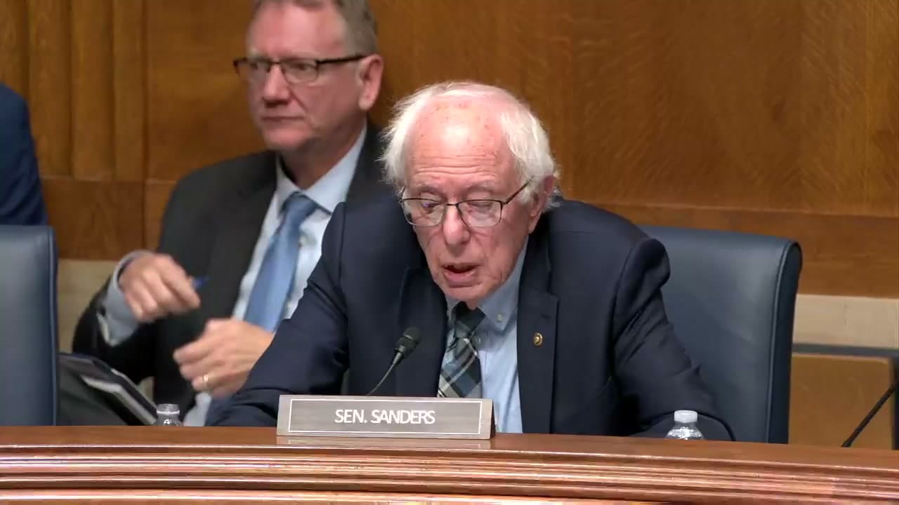 Senator Bernie Sanders speaking at his nameplate during a Senate HELP Committee hearing